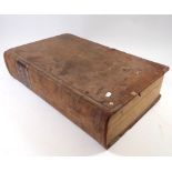 A large leather bound bible with comments by Rev S Clarke, published 1813