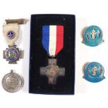 A silver General Service medal, two silver and enamel nursing medals and two other silver medals