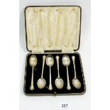A set of six silver coffee spoons with dog nose terminals, cased, Birmingham 1941
