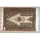 A small brown prayer rug, 87 x 61cm