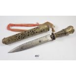 A 19th century Tibetan knife with steel blade and pierced decorative handle and sheath, blade