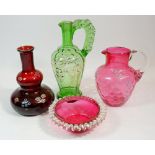 Two Victorian floral painted glass jugs, a ruby glass carafe painted flowers and a cranberry glass