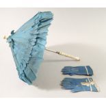 A Victorian bone handled doll's parasol, 17cm and pair of blue leather dolls gloves, 7cm long