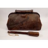 A small Victorian Gladstone style bag, 35cm and a wooden fishing priest, 28cm