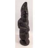 A carved African figure with a spear, 38cm