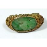 A Chinese silver gilt filigree and jade scarf clip
