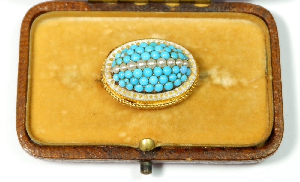 A Victorian yellow metal oval domed brooch set turquoise and seed pearls, 2.5cm wide, boxed