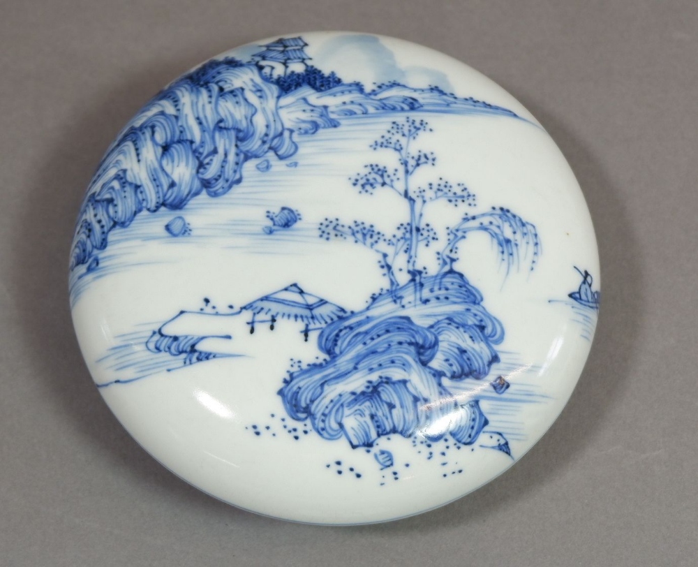 A Chinese blue and white traditional ink paste circular box decorated landscape motifs to top and
