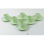 A Minton vintage set of six green coffee cups and saucers