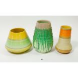 A Shelley green Drip Ware Art Deco Harmony Ware vase, 16cm and two others in green and orange