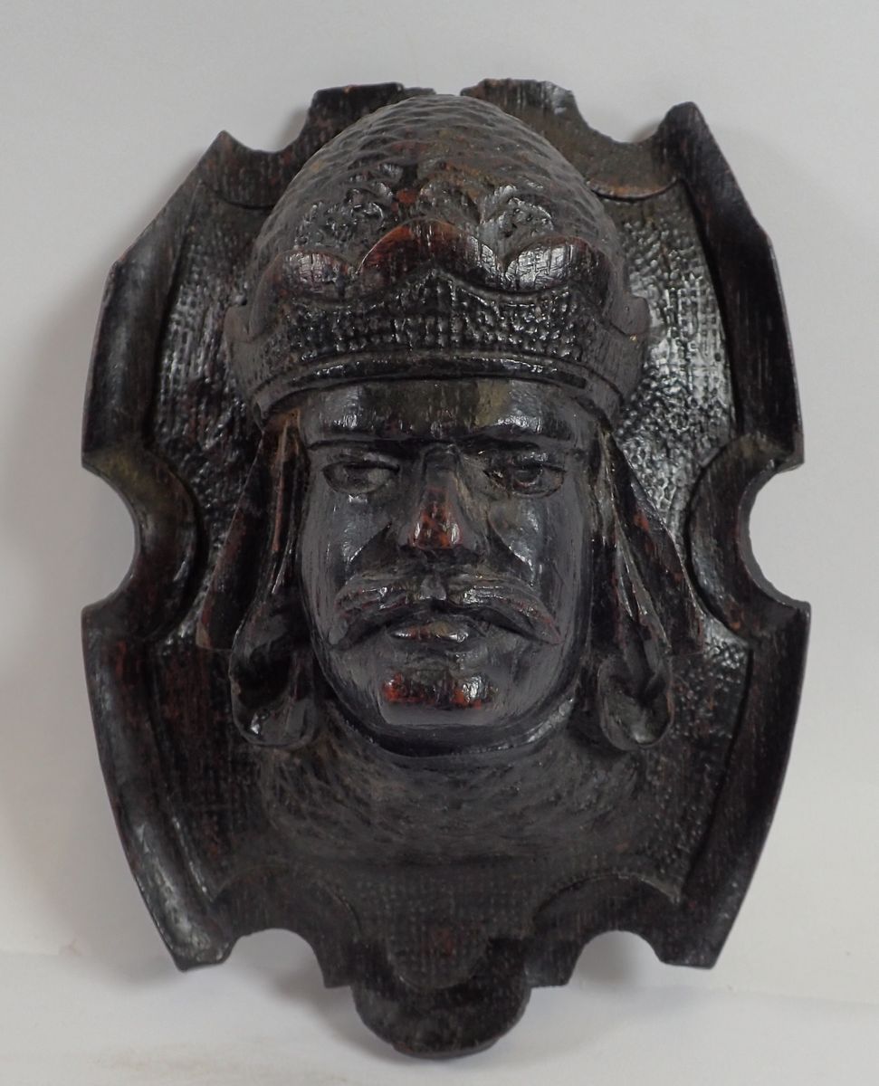 A Victorian ebonised carved wood wall mask form wall bracket, 17cm