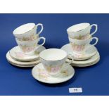 A Wren floral part tea service comprising five cups and six saucers and six tea plates