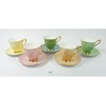 A Royal Albert harlequin part set of five cups and saucers