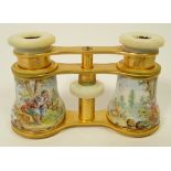 A pair of late 19th century enamelled opera glasses decorated rococo landscape scenes with mother of