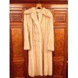 A Faulkes white vintage full length fur coat