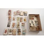 A box of cigarette cards including Ogdens Guinea Gold's