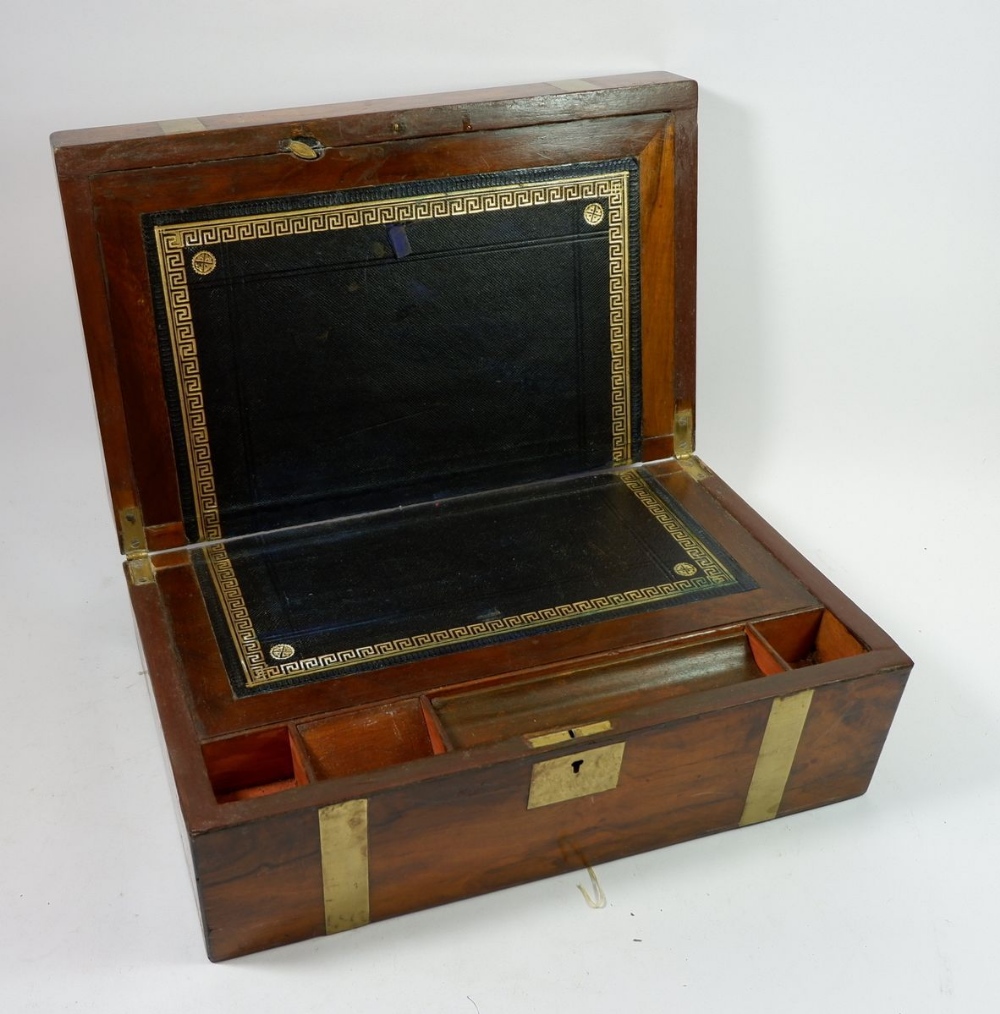 A 19th century walnut brass bound writing slope with fitted interior, 40cm diameter