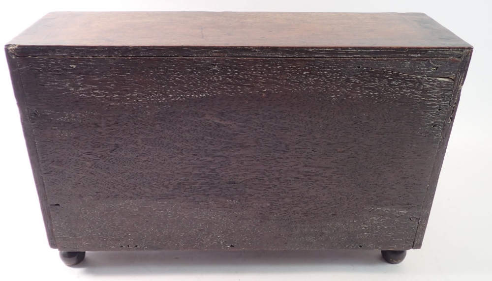 A George II oak slope front miniature cabinet fitted drawers, possible the base to a toiletry - Image 4 of 4