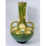 A large Austrian Faience vase painted yellow tulips incised monogram and bird mark to base, 47cm