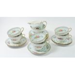 A Shelley Crochet vintage floral tea service comprising: six cups and saucers, sugar and milk and