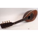 A 19th century American eight string mandolin, bone pegs and inlay, labelled inside Regal MFG Co