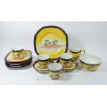 A Czechoslovakian tea service printed desert scenes with camels comprising: four cups and