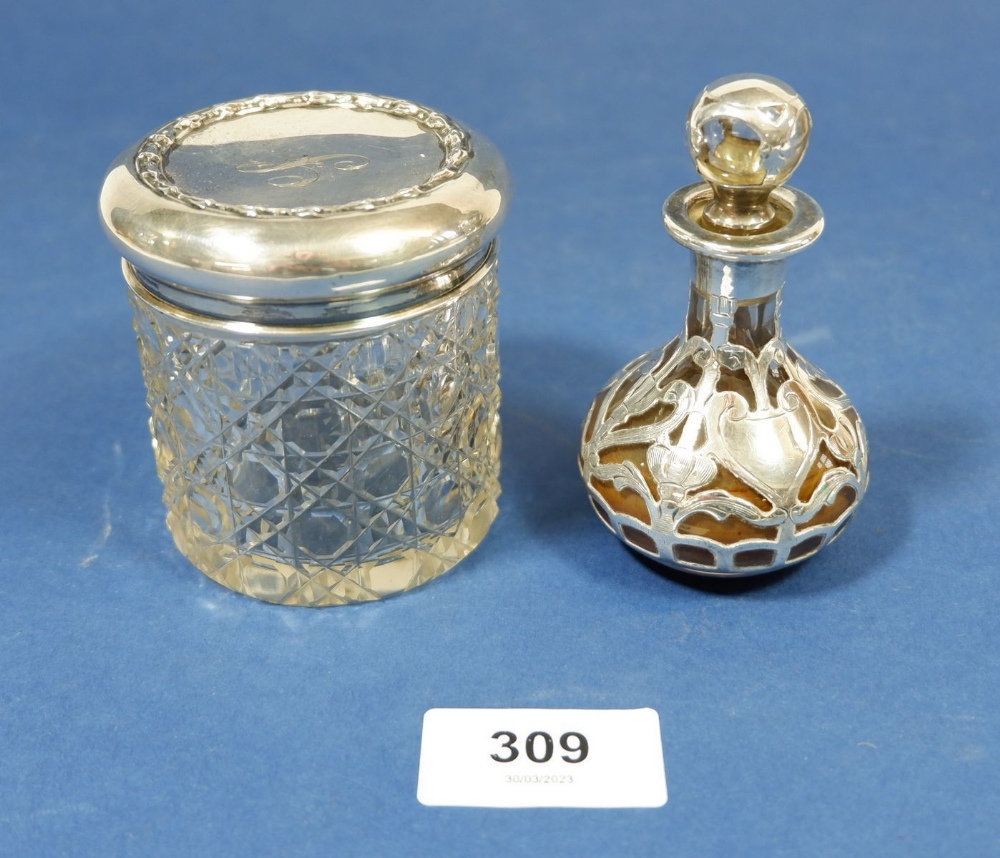 A silver encased scent bottle and a dressing table jar with silver lid, Birmingham 1909