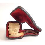 A 19th century meerchaum pipe in the form of a ladies head, 9cm long in case