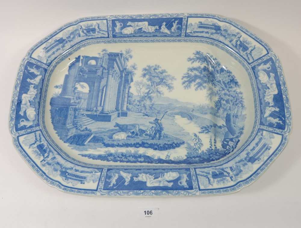 A Victorian large pearl ware meat plate decorated pastoral scene and ruins, with gravy well by R