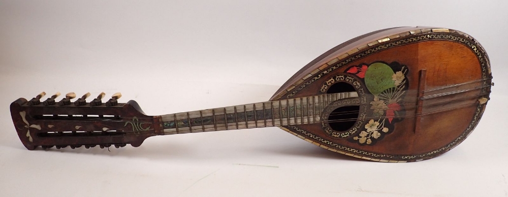 A 19th century twelve string mandolin with a mother of pearl and abalone fingerboard, fluted