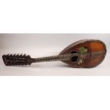 A 19th century twelve string mandolin with a mother of pearl and abalone fingerboard, fluted