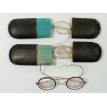 Three antique sets of spectacles, two cased