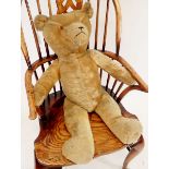 A large vintage straw filled gold plush teddy, 80cm