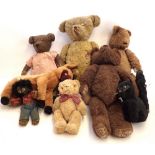 A box of antique and vintage soft toys including teddy bears, horse and musical cat