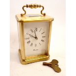 An English made eight day maritime brass carriage clock with key, 13cm tall