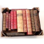 A box of antique books with leather bindings