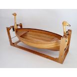 An unusual wooden childs rocking boat with duck head decoration to ends, 128cm long