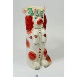 A Victorian Staffordshire Spaniel jug with floral hat, 25cm tall