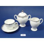 A Wedgwood Amhurst tea service comprising six cups and saucers, six tea plates, milk and sugar