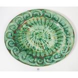 A Bwthyn Pottery green oval dish, 38cm across