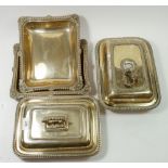 Two silver plated rectangular entree dishes and covers and two open dishes