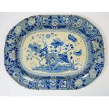 An early 19th century Spode blue and white meat plate decorated flowering trees and insects in