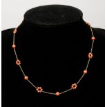 An Edwardian 9 carat gold and coral bead necklace