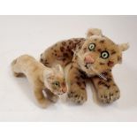 A Steiff leopard (ear detached no button) and lion cub