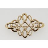 A 9 carat gold brooch with intertwined open design, 5cm long, 6g