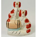 A Victorian Staffordshire group of two spaniels and a barrel, 20cm