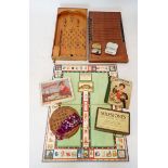 A group of old parlour games including 'Shove half Penny', Bagatelle, solitaire, Game of Life