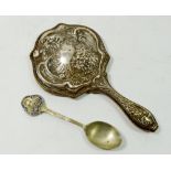 A silver plated small hand mirror, 18cm long and a commemorative Gloucester Co-op teaspoon 1866-1935