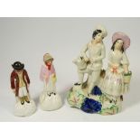 A Victorian Staffordshire figure of gardener and companion, 22cm tall plus two Victorian figures