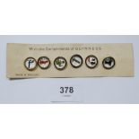 A set of six vintage Guinness zoo animal buttons on original card